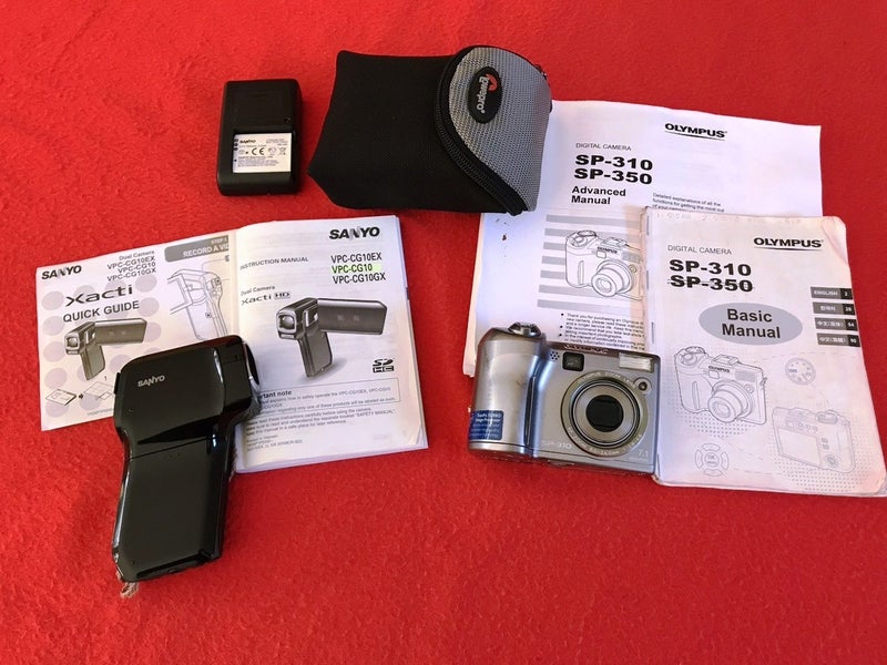 Sanyo video camera plus Olympus still camera Carousel 1
