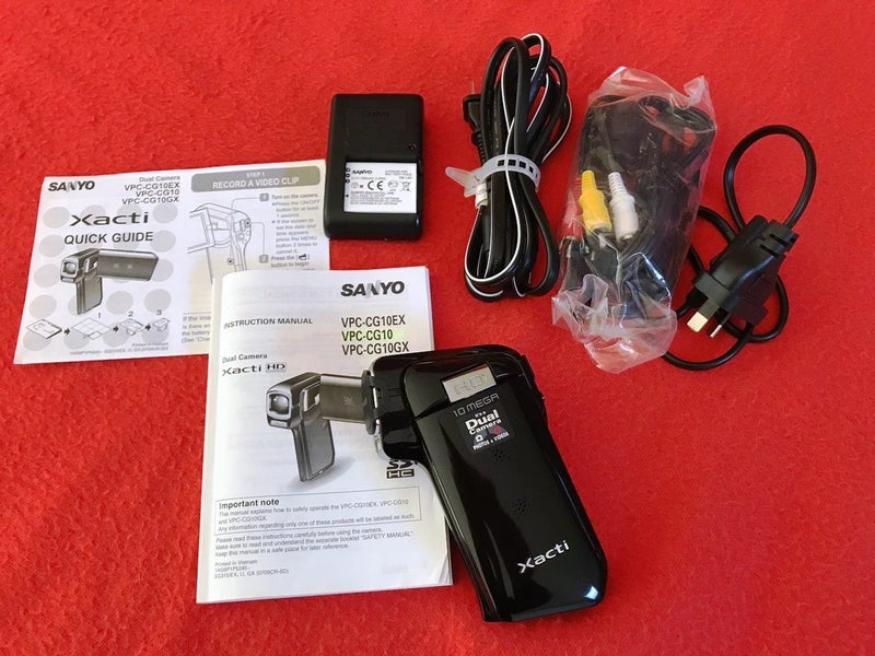 Sanyo video camera plus Olympus still camera Carousel 7
