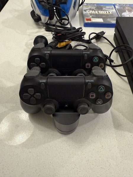 PS4 Pro 1TB, 2x controllers, 3x games + headset Carousel 3