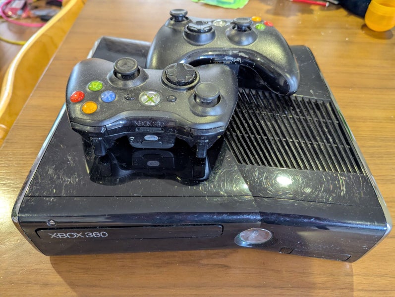 Xbox 360 with 2 remotes and 11 games Carousel 1
