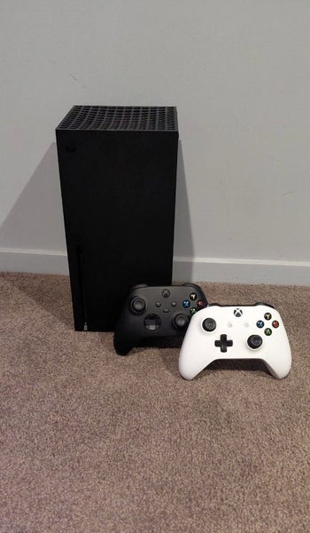 Xbox series x with 2 controllers Carousel 1