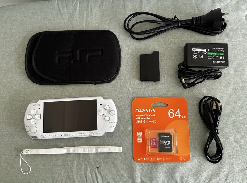 PlayStation Portable (PSP) 3000 – Pearl White | 64GB | Fully Set Up Carousel 1