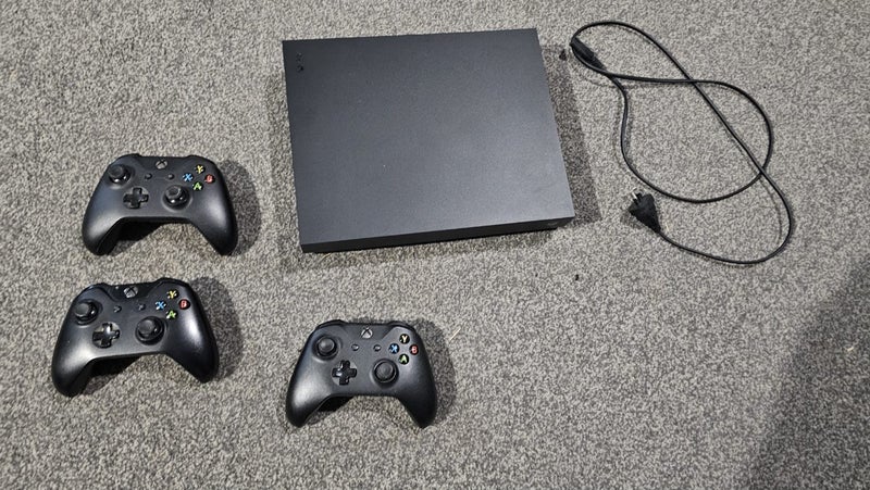 Xbox One X and 3 Controllers Carousel 1