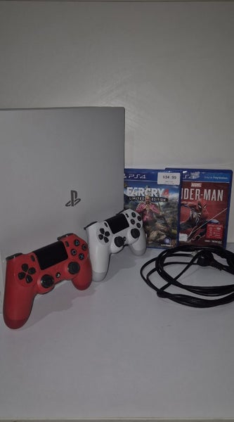 Ps4 Pro(White) + 2 remotes + 2 games Carousel 1
