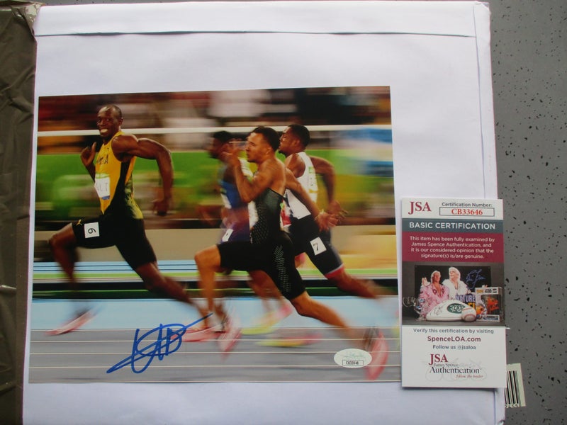 Usain Bolt "Fastest Man on Earth/ 8 x Olympic Gold signed Photo + AUTHENTICATION Carousel 1