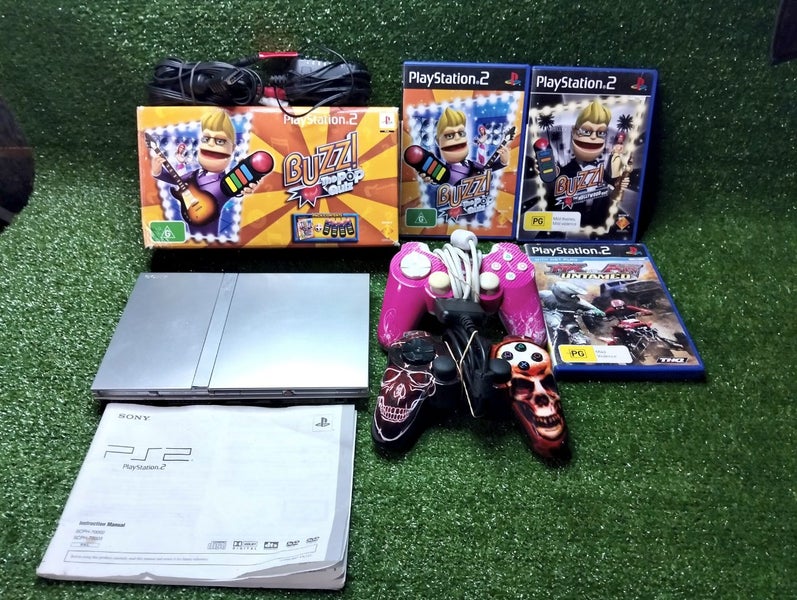 Silver PS2 slim, X2 controllers, boxed buzz game, X2 more games, cords & manual Carousel 1