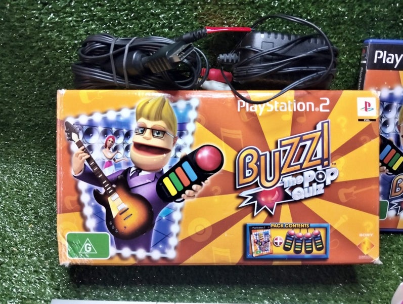 Silver PS2 slim, X2 controllers, boxed buzz game, X2 more games, cords & manual Carousel 2