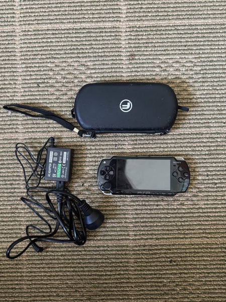 Psp console with charger and protector case Carousel 1
