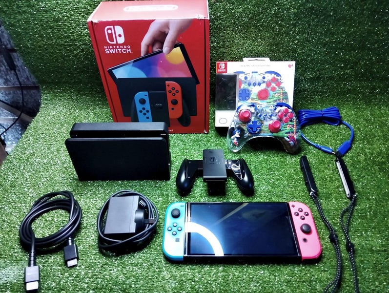 Nintendo switch OLED model, with box , accessories & Sonic hedgehog pro control Carousel 1