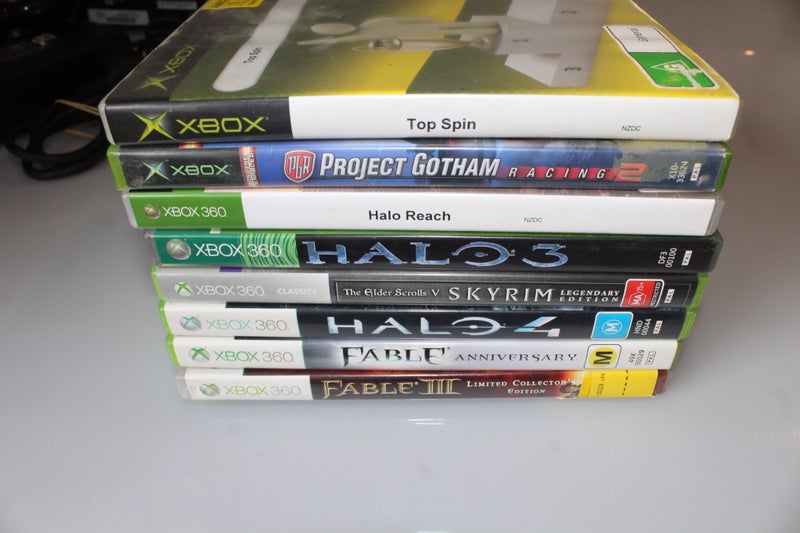 Xbox 360 E Console Bundle with 1 Controller, Power Supply, and 9 Games Carousel 4