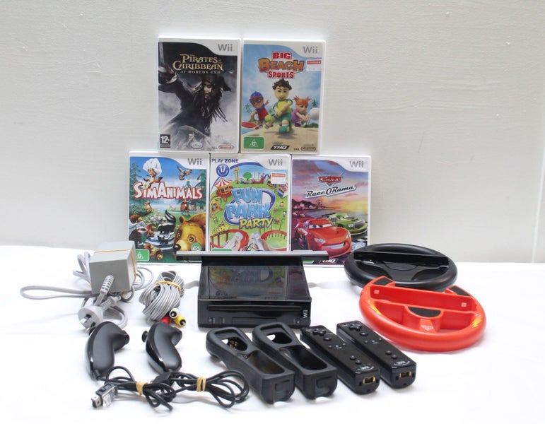 Wii Package: Nunchucks, Remotes & Games Carousel 1