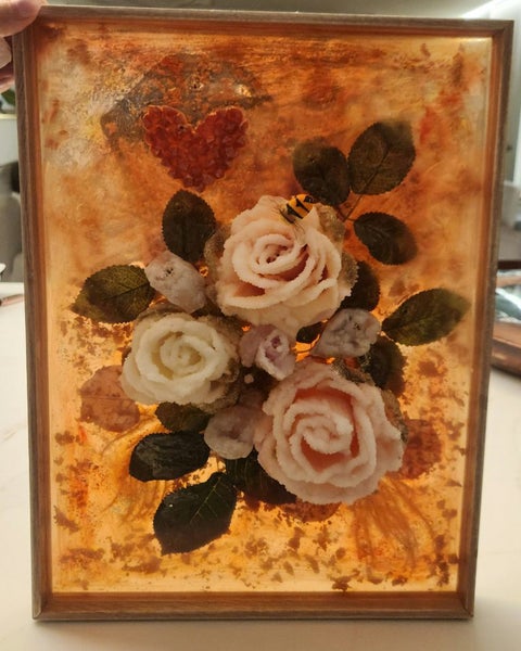 Crystals grown on artificial flowers using borax Carousel 9