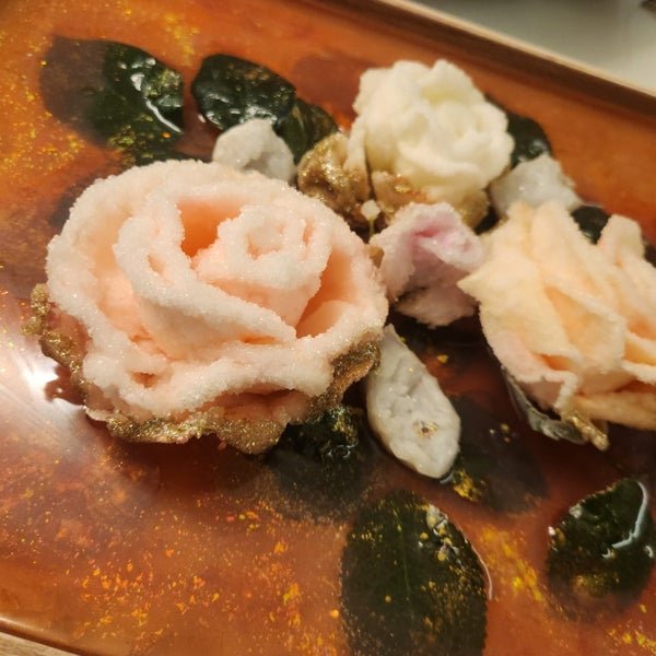 Crystals grown on artificial flowers using borax Carousel 1