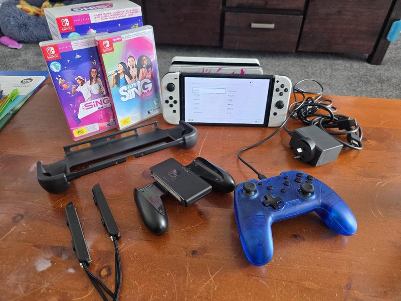 Nintendo switch Oled Bundle with Lets sing Carousel 2