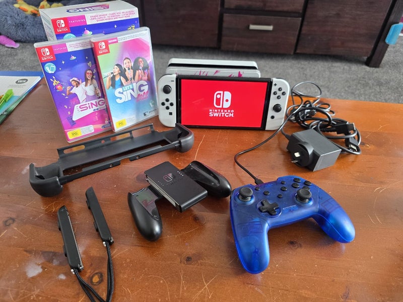 Nintendo switch Oled Bundle with Lets sing Carousel 1