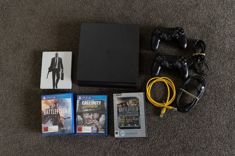 Playstation 4 with 2 controllers and games Carousel 1