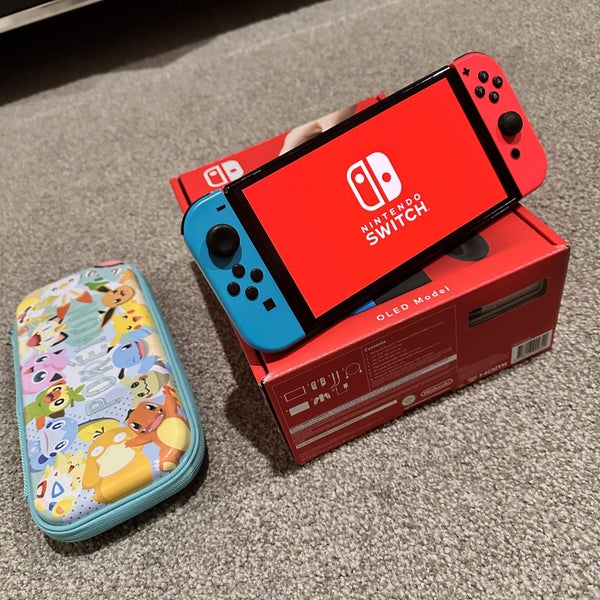 Nintendo Switch OLED Console with a Free Game and Protection Case Carousel 1