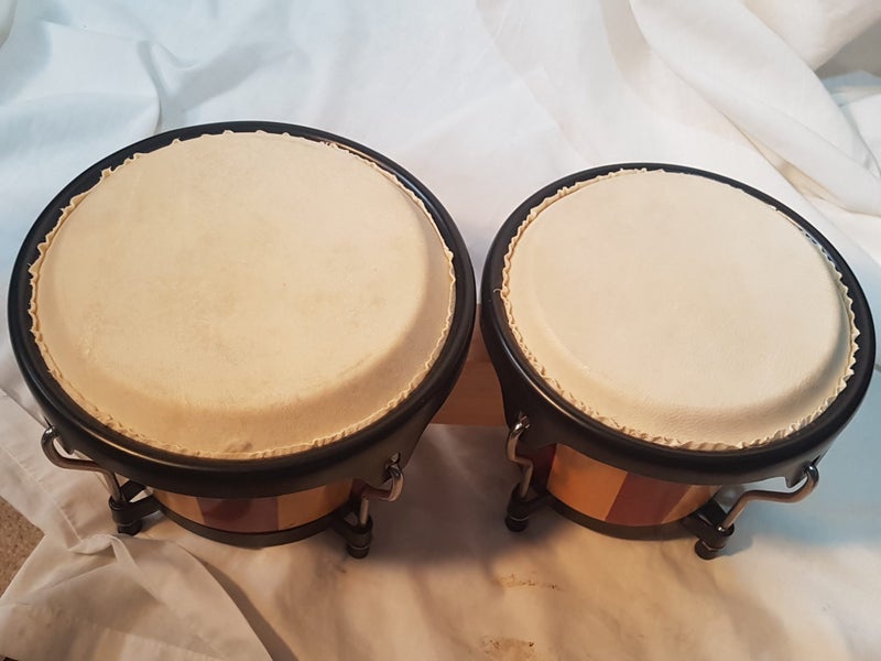 Bongos. 6 & 7 inches diameter. Sound great. new . good quality. Striped. Carousel 1