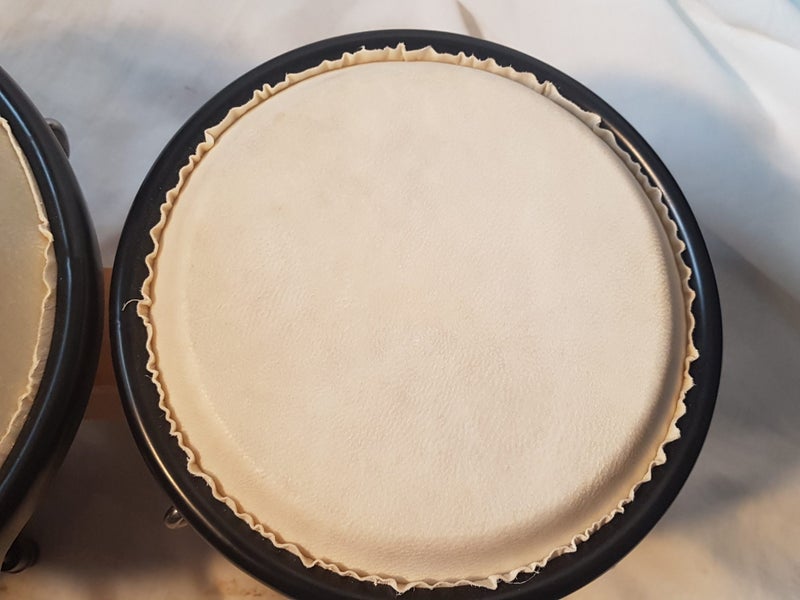 Bongos. 6 & 7 inches diameter. Sound great. new . good quality. Striped. Carousel 6