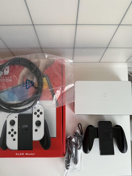Nintendo Switch OLED – Excellent Condition + Crysis Game + Original Charger Carousel 2