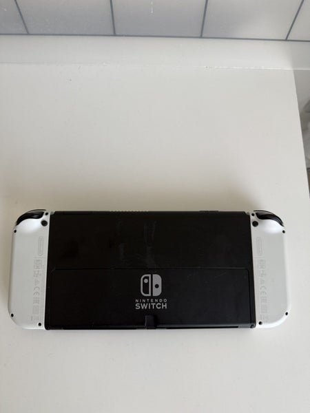 Nintendo Switch OLED – Excellent Condition + Crysis Game + Original Charger Carousel 3