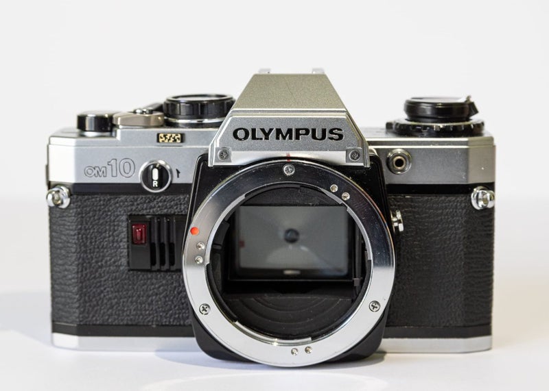 Olympus OM10 Body + Manual Adapter63801470032386111