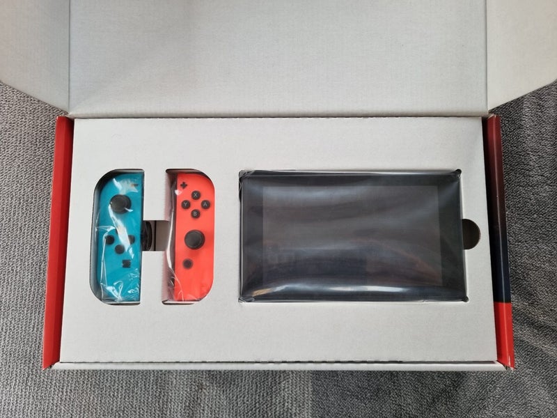Nintendo Switch Neon Console + 2 Games Carousel 2