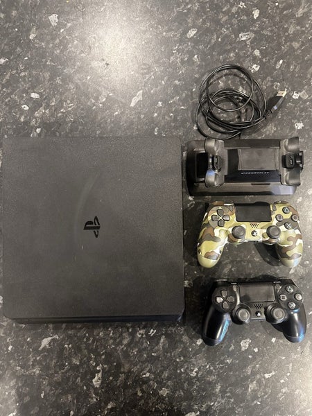 PlayStation 4 Slim 1TB + 2 Controllers + Dual Charging Dock Carousel 1