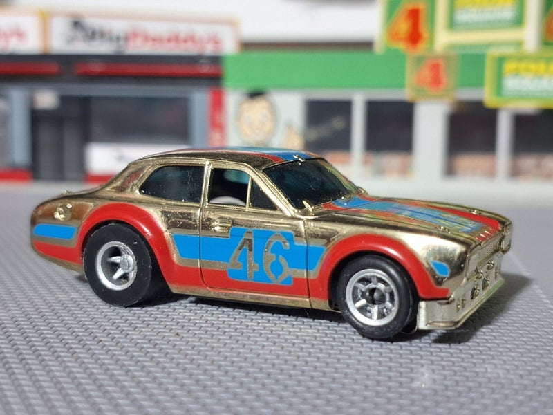 Vintage AFX Gold Chrome Ford Escort #46, Speed Shifter Chassis Carousel 1