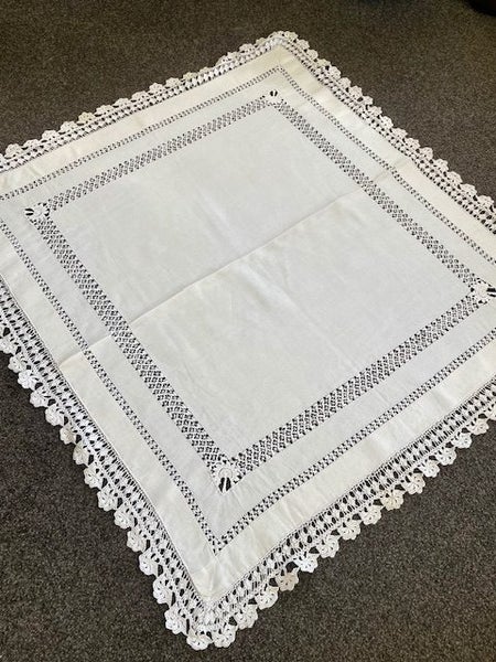 A beautiful very vintage white linen cloth with a deep hand crocheted edging Carousel 1