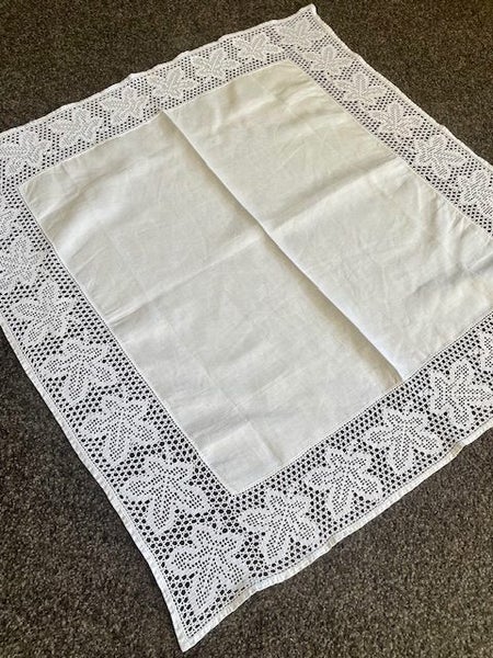 A beautiful very fine white vintage linen tablecloth with a filet crochet edging Carousel 1
