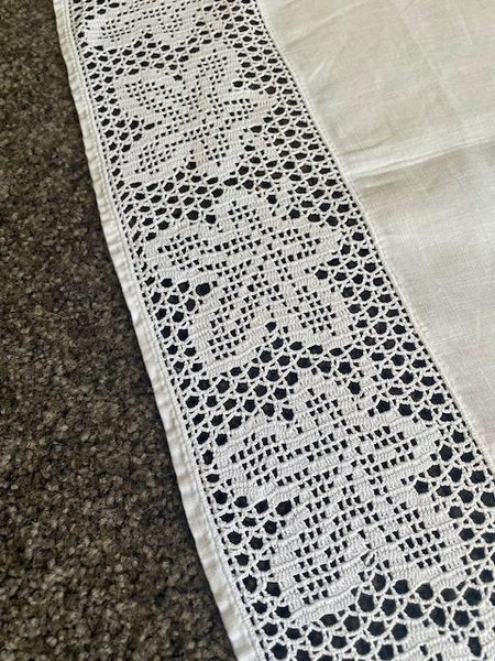A beautiful very fine white vintage linen tablecloth with a filet crochet edging Carousel 2