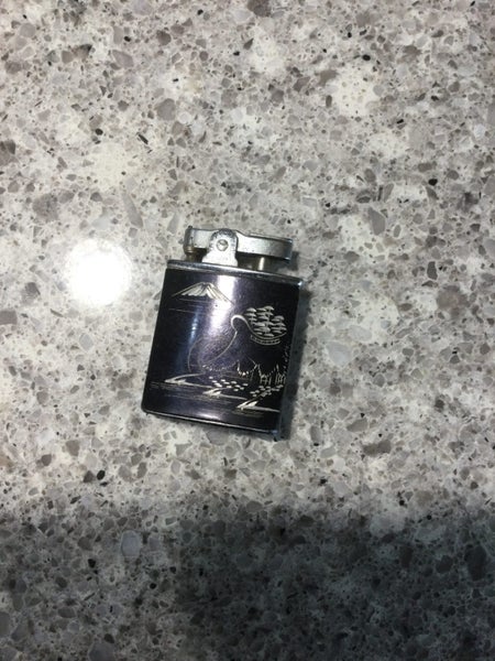 A RARE VINTAGE JAPANESE MUSICAL CIGARETTE LIGHTER Carousel 1