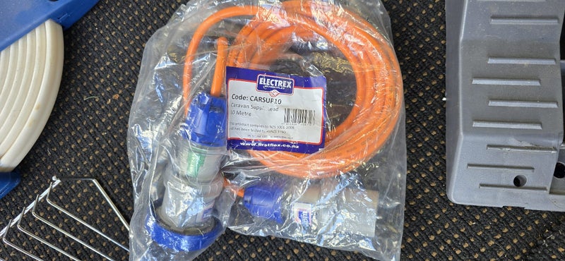 Camping equipment wheel chocks, power cable, hose reel plate seperaters Carousel 1