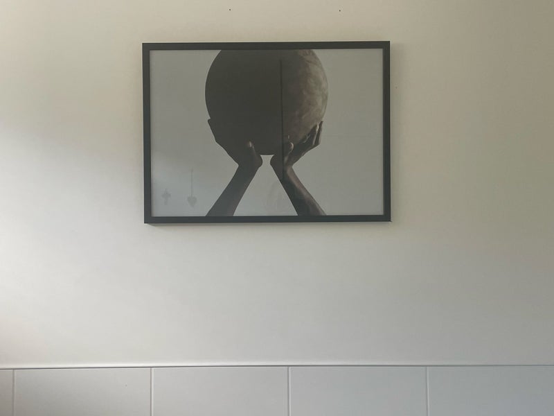 Large picture - hands holding the earth - black frame Carousel 1