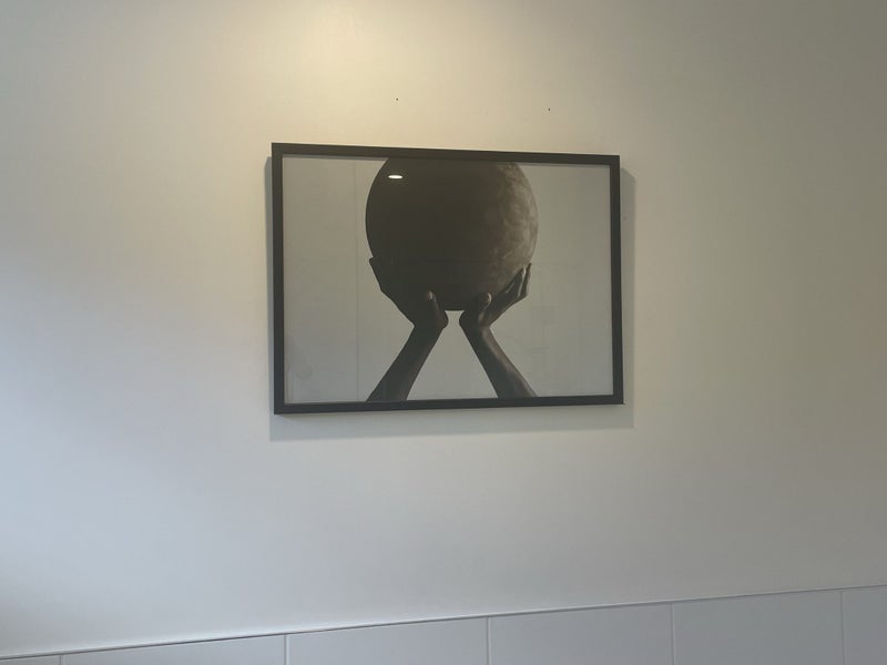 Large picture - hands holding the earth - black frame Carousel 3