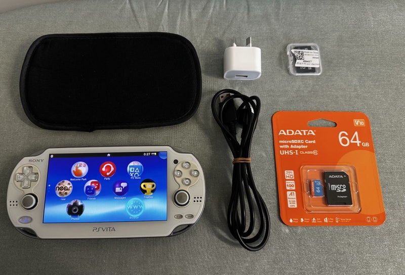 PS Vita PCH-1000 – Crystal White | 64GB | OLED Display | Fully Set Up63735123251970110
