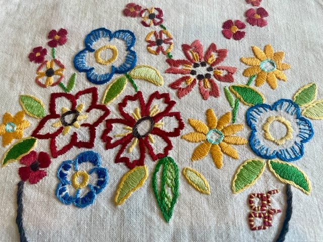 A lovely bright hand embroidered Linen Cover Carousel 2