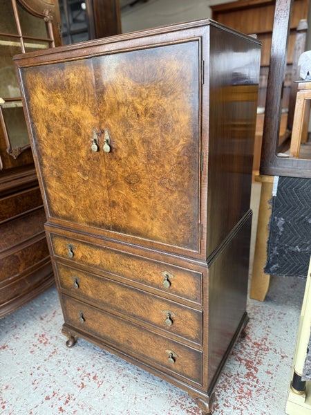 A Superb Book Matched Burr Walnut Cabinet Carousel 1