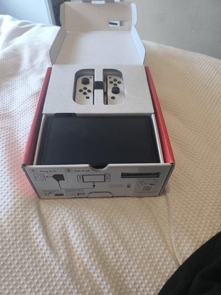 Nintendo Switch OLED + Handheld Grip Carousel 1