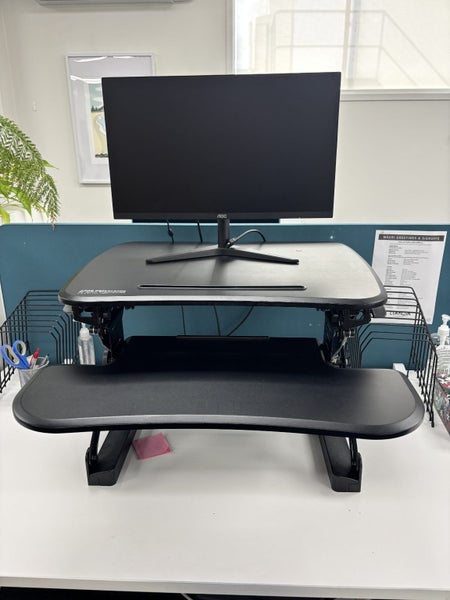 Make any desk a stand-up desk! Arise Deskalator Height Adjustable Stand Carousel 1