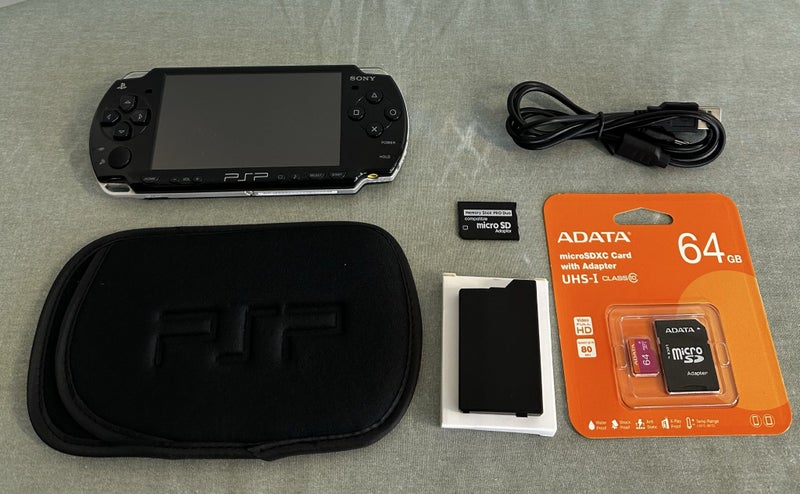 PSP 2000 – Piano Black | 64GB | Fully Set Up Carousel 1