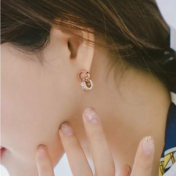 CLASSIC INTERLOCKING CRYSTAL ROMAN NUMERAL DANGLE EARRINGS – Rose Gold Tone Carousel 1
