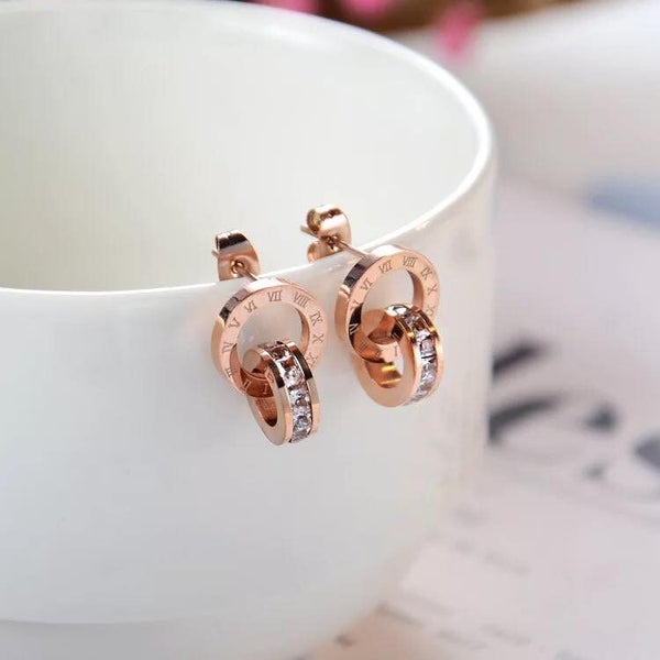 CLASSIC INTERLOCKING CRYSTAL ROMAN NUMERAL DANGLE EARRINGS – Rose Gold Tone Carousel 2