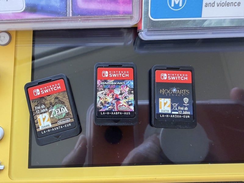 Nintendo Switch lite- with games Carousel 2