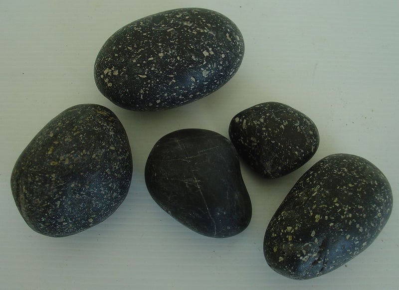 Black Speckled River Worn Rocks x 4 + 1 Other. Carousel 1