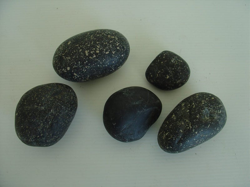 Black Speckled River Worn Rocks x 4 + 1 Other. Carousel 2