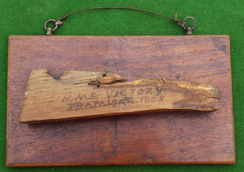 A mounted small section of (Battle-damaged?) OAK from H.M.S. VICTORY dated 180563950891846275110