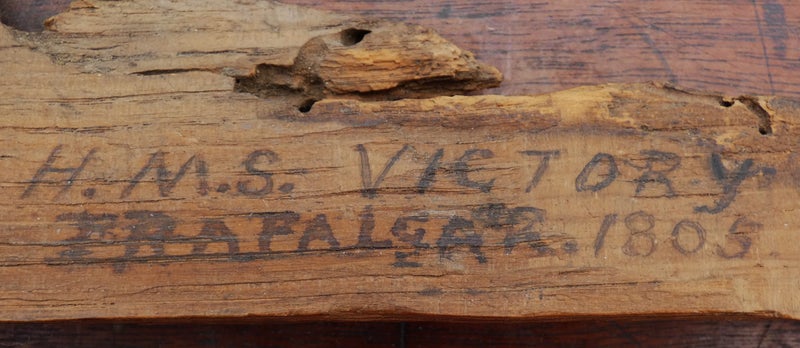 A mounted small section of (Battle-damaged?) OAK from H.M.S. VICTORY dated 180563950891846275111