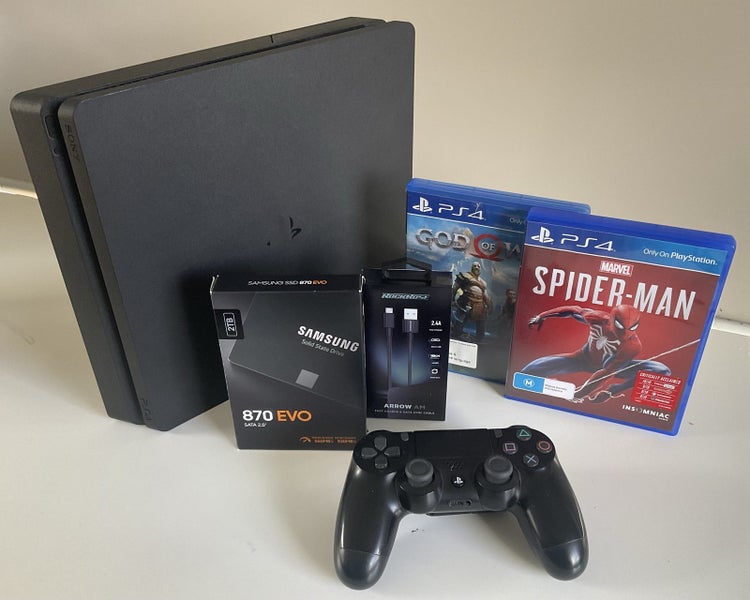 PS4 SLIM- 2TB SSD Bundle **PRO’s LITTLE BIGGER BROTHER** - **MINT CONDITION** Carousel 1